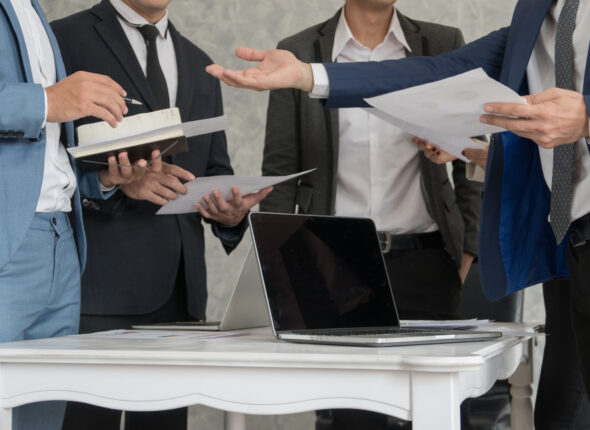 Business human hands holding papers, pen and notebook during bra