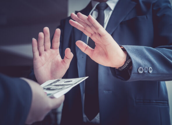 Business man refusing money to take the bribe the concept of cor