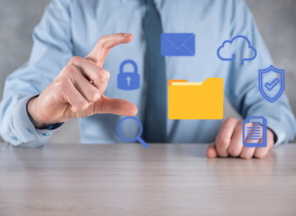Document Management System DMS .Businessman hold folder and document icon.Software for archiving, searching and managing corporate files and information.Internet Technology Concept.Digital security